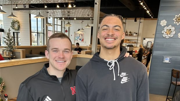 Keelan Smith with Nebraska wide receivers coach Garret McGuire.